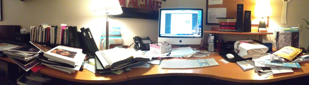 The panorama shot distorts the actual shape of my desk. However, it does show the ministry clutter I seem to have accumulated.